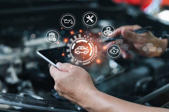 Car business concept and technology on virtual screen, Serviceman working onsite use tablet check service cycle for maintenance of car with the engine room in the background, Smart work of car service - Powered by Adobe