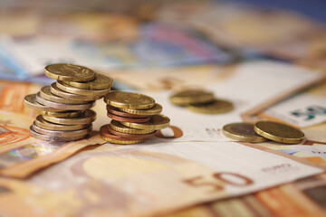 euro coins placed on top of each other	