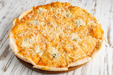 delicious hot traditional italian pizza on a white wooden rustic background