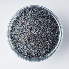 poppy seeds on a white acrylic background