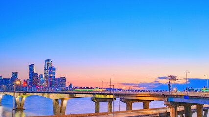 Naklejka premium Cityscape night view of Yeouido, Seoul at sunset time