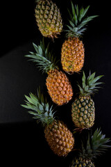 High Quality Pineapple photography, Pineapple Top View, Pattern design, Green and yellow Pineapple with green leaf on black background