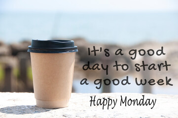 It is a good day to start a good week text with coffee cup and blurred beach background. Wishes...