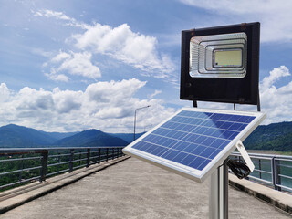 Photovoltaic spotlights use solar energy on the dam ridge. pure energy concept
