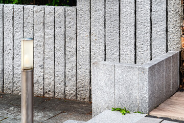 White and black granite stone palisades in different heights for garden design - obrazy, fototapety, plakaty