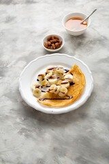 Breakfast crepes with banana and honey nuts pancake food