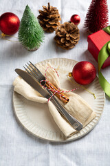 Christmas dinner table setting concept plate decorations gift box