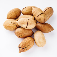 delicious fresh pecans on a white acrylic background