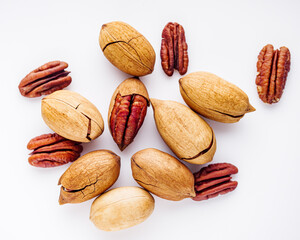 delicious fresh pecans on a white acrylic background