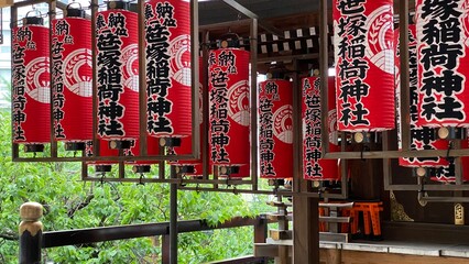 The red Japanese paper lanterns with shrine namings, at “Yushima Tenjin”, honorable landmark...
