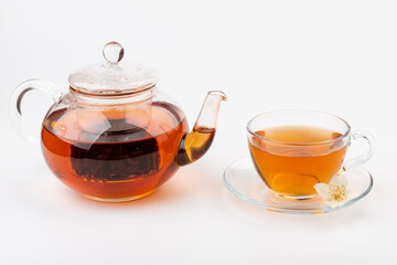 Composition with cup of jasmine tea and flowers on light background