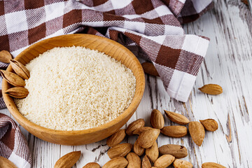 almond flour on a white wooden rustic background