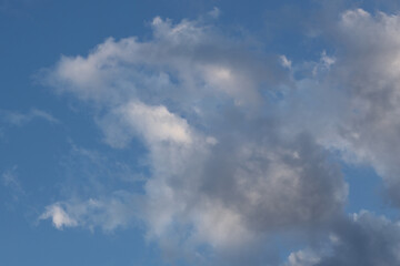 White clouds against the blue sky.