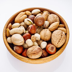 set of different nuts on a white acrylic background