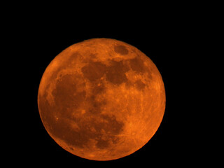 red moon at night in the sky captured from the earth (big moon)