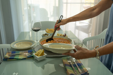Table served with honeyed rice and good red wine.