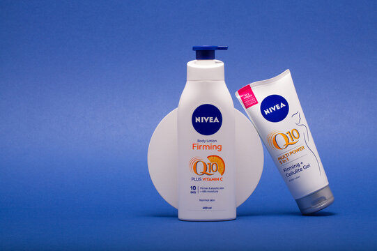 Nivea Q10 Body Lotion Firming and Cellulitide Gel isolated on the blue background.
