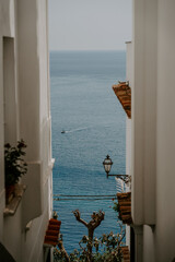 Positano, Amalfi Coast in Italy- the view of peaceful blue sea and luxury charter boats, seaside,...