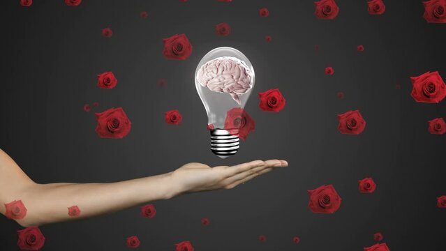 Animation of red roses over caucasian woman holding light bulb with brain