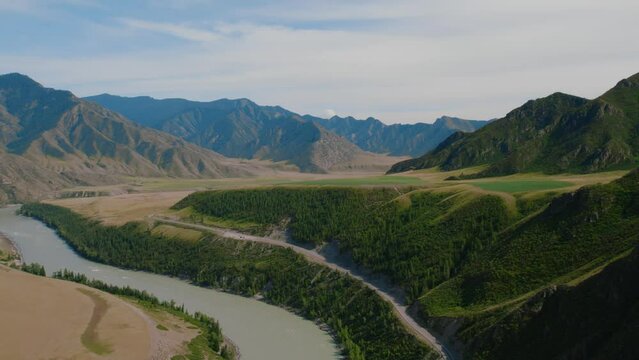 Valley mountains of Altai and Katun river, Siberia, Russia. Beautiful summer nature landscape at during daytime. Aerial view from a drone