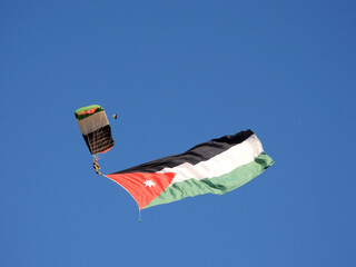 Amman, Jordan - jordanian flag and paratrooper in air