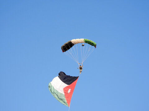 Amman, Jordan - jordanian flag and paratrooper in air