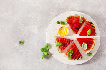 grilled watermelon slices with lemon and basil. summer dessert