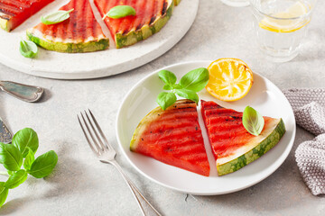 grilled watermelon slices with lemon and basil. summer dessert