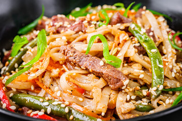 delicious chinese fried noodles on a black background