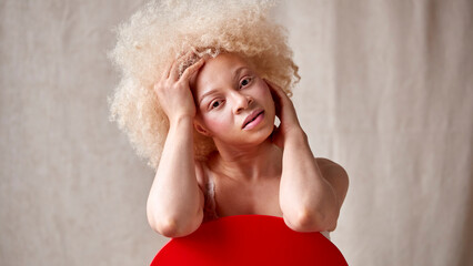 Studio Shot Of Natural Albino Woman In Underwear Promoting Body Positivity Sitting On Chair - obrazy, fototapety, plakaty