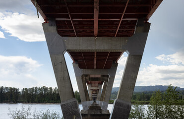 Mission Bridge over Fraser River during Sunny and Cloudy Spring Season Day. Fraser Valley, British Columbia, Canada.