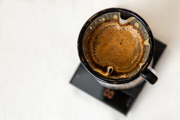 Coffee brewed by the pouring method. Alternative ways of brewing coffee. Coffee shop concept.