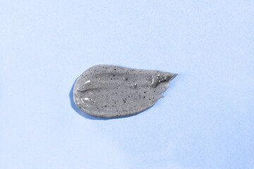 Mud smear for body skin treatment and care. Natural medicine, dirt sample with charcoal top view.