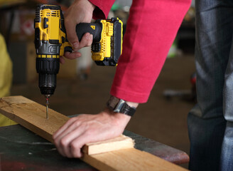 driving the screws with a drill - 511090638