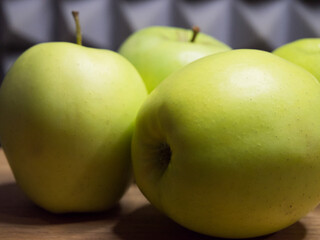 Several green apples, side view. Fruit close-up.