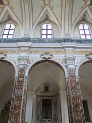 Interior of Italian church with three windows and pillars with Christ in the middle.  Cattedrale...