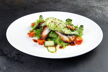 Salad with eel, avocado and herbs.