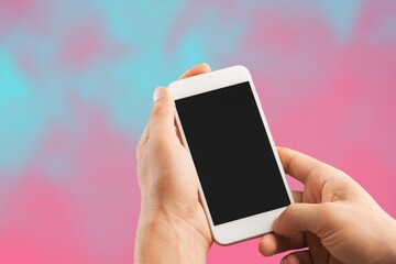 Hand holds phone Sample social media app interface on mobile phone