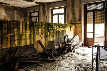 
July 2022, Italy. Urbex in Italy. Dilapidated corridor of an abandoned college