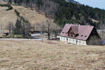 brick building with a gable roof near the Andrzejówka hostel in Rybnica Leśna, Poland, and its surroundings, early spring, nice light © TK_Office
