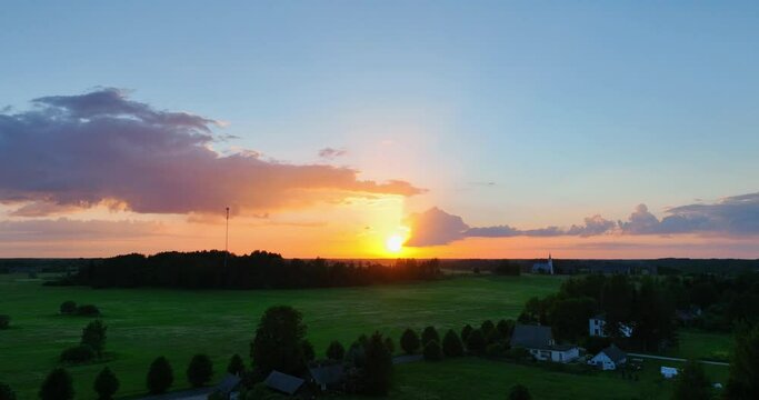 Amazing aerial view of beautiful sunset over the small country town.