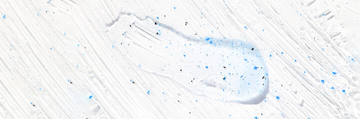 Face scrub texture. Cream skincare cosmetic. Organic stroke. Feet oily cleanser smudge. Particles in gel. White background. Top view. Fluid treatment