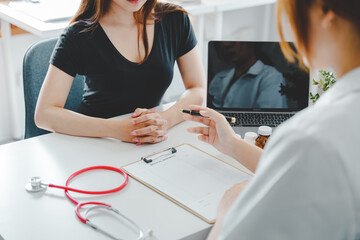 portrait of a female doctor She is recommending medications and treatment methods at the clinic.