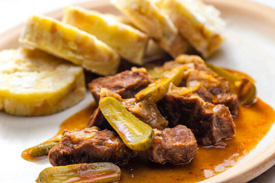 beef meat with picles sauce and dumplings