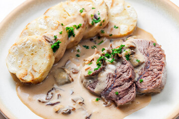 meat with mushroom sauce and karlsbad dumplings