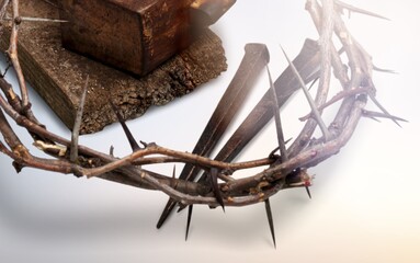 Crown of thorns symbolizing the sacrifice, suffering and resurrection of Jesus Christ and Easter light background