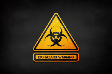 Yellow triangle warning sign with biohazard symbol on black background 