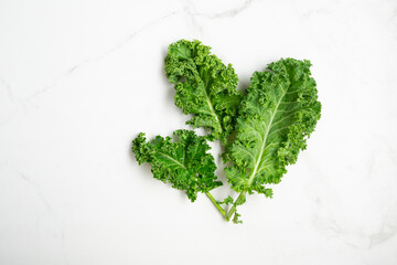 Vegan food background kale leaves on light surface super food