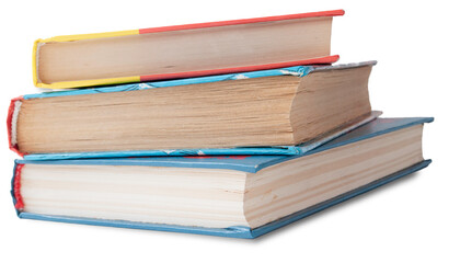 Books on a white background close-up stacked vertically