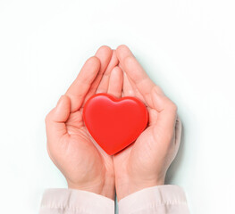 Obraz na płótnie Canvas Red heart in Doctor 's hands on white background. Healthcare and hospital medical concept,organ donation concept.Symbolic of Valentine day.Heart day.?opy space.